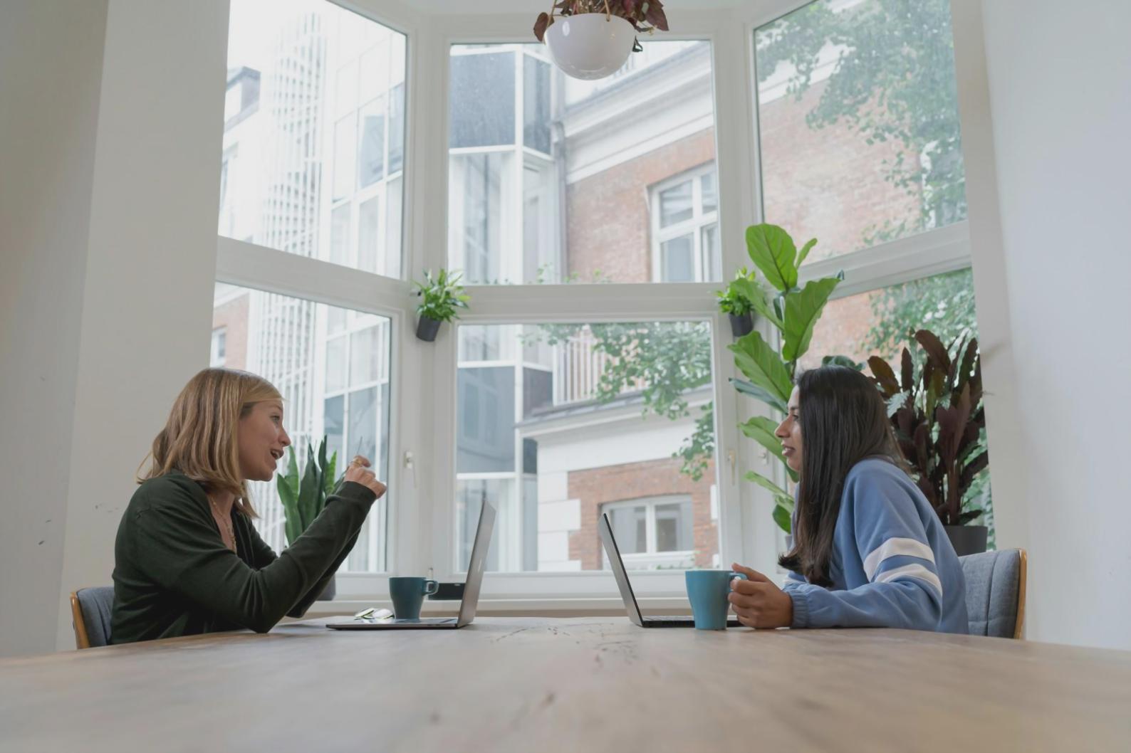 Student working on laptop with financial spreadsheets and Australian study materials
